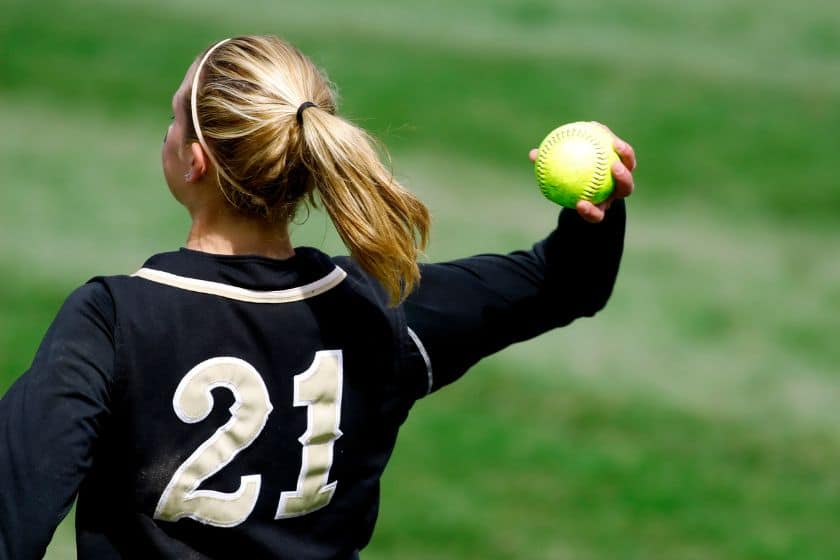 Girl throwing a softball